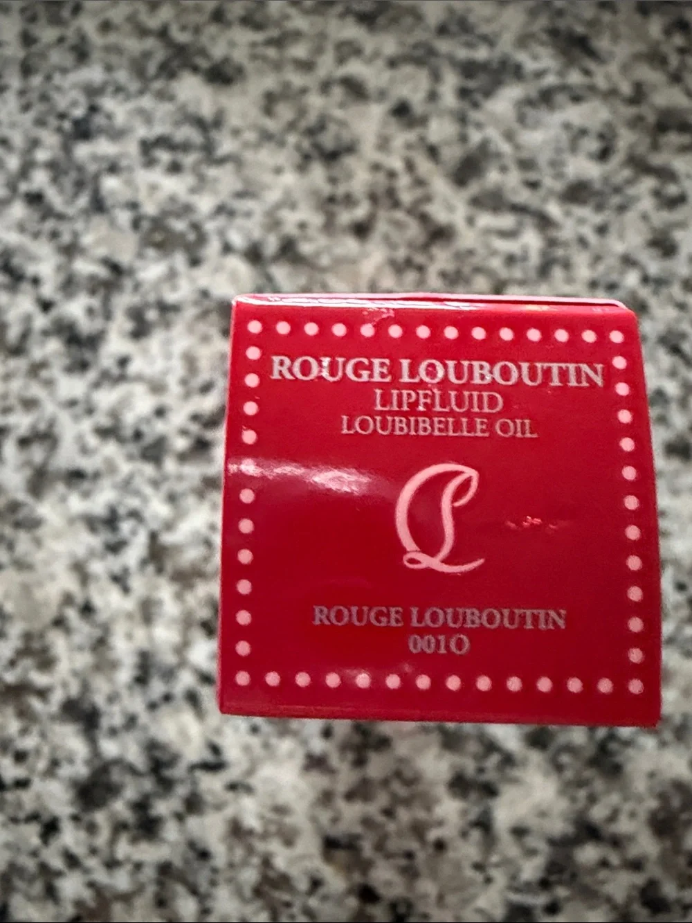 Christian Louboutin Rouge Lip Oil in Vibrant Red
